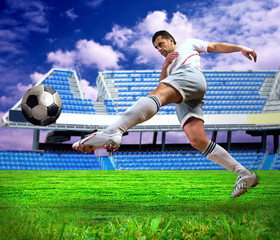 Happiness football player after goal on the field of stadium und