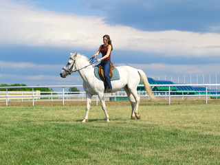 girl astride a horse