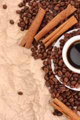coffee with cinnamon on paper background