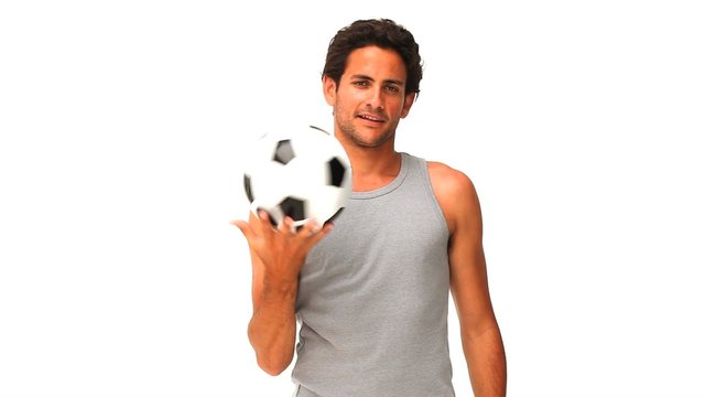 Handsome man with a soccer ball