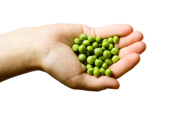 Woman's hands holding green peas