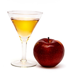glass of juice and red apple