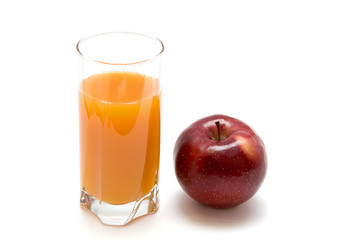 glass of juice and red apple