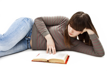 Girl laying on the floor and reading book