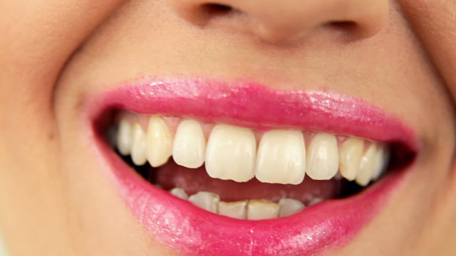 Smiling woman mouth with great white teeth close up