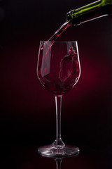 wine red alcohol bottle splashing