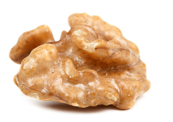half peeled walnut closeup