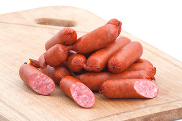 Meat delicatessen on the board isolated on the white