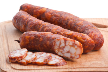 Meat delicatessen on the board isolated on the white