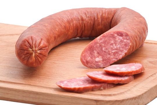 Meat delicatessen on the board isolated on the white