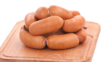 Meat delicatessen on the board isolated on the white