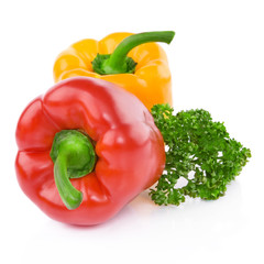 Yellow And Red Peppers decorated with greenery