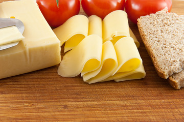 Plate with cheese and tomatoes and bread