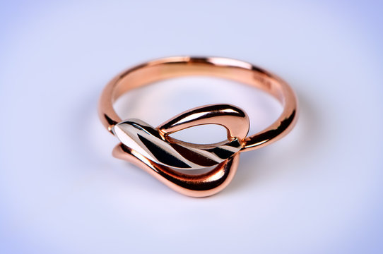 Female gold ring macro photo.