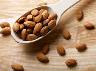 Almonds on wooden background