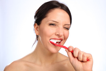 Dental care beautiful young woman brushing teeth