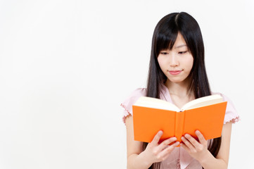 Fototapeta premium beautiful asian woman reading a book