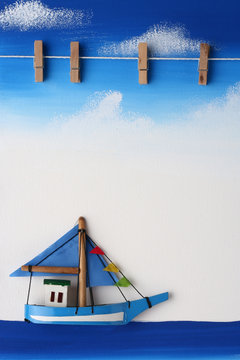Picture Board with Wooden Paper Clip on Blue Sky, Ocean and Boat