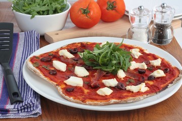 Homemade pizza with ham and ricotta cheese