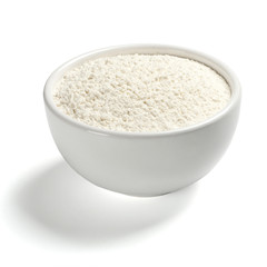 Wheat flour in a plate on white background