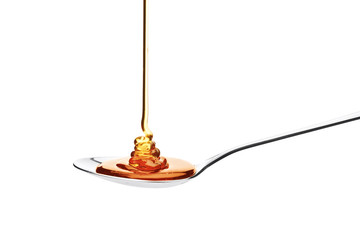 Honey falling on a spoon