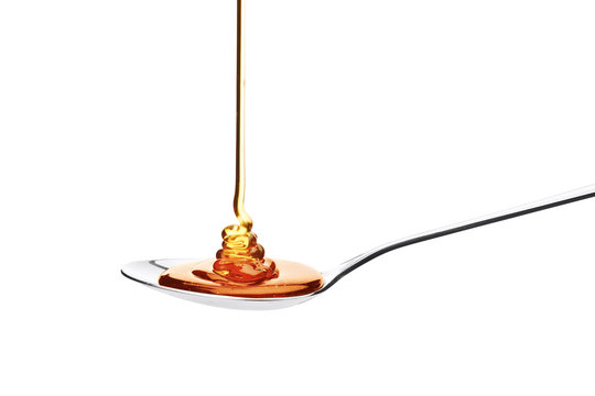 Honey Falling On A Spoon