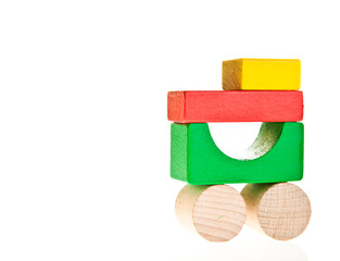 Obraz premium Wooden toy colorful blocks isolated on white