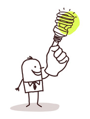 man with green light bulb on finger