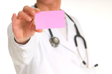 female doctor with stethoscope holding a pink note