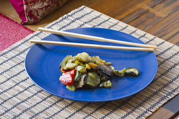 chopsticks and mixed grilled vegetables