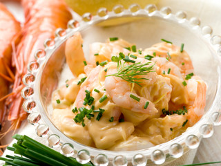 shrimp cocktail over glass bowl