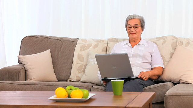 Mature woman working on her laptop