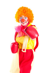 A girl dressed as a clown with red nose