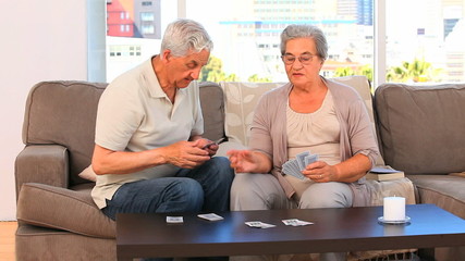 Couple playing cards - Powered by Adobe