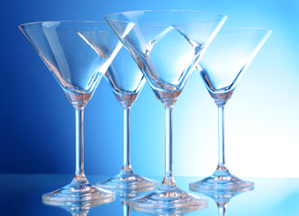 empty glasses of martini on the light blue background