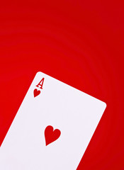Ace of hearts on red background