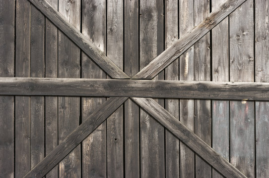 Old wooden door with big cross for background