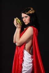 Ancient greece woman with a bunch of grapes