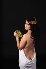 Ancient greece woman with a bunch of grapes - obrazy, fototapety, plakaty
