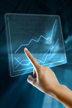 a woman hand make a graph on a digital screen