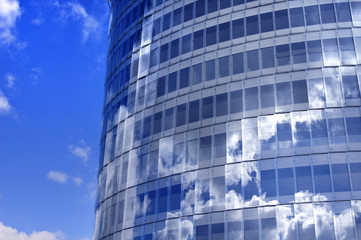 Business building windows and sky reflection