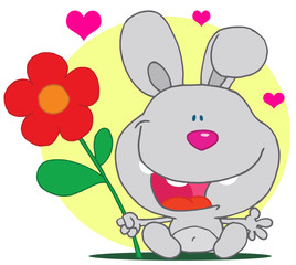 Grey bunny holds flower