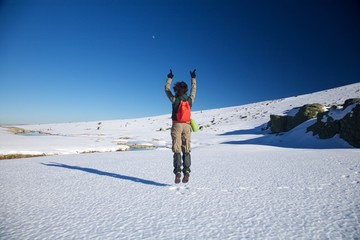 flying winter hiking woman