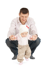 baby making first steps with father help