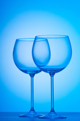 Wine glasses against gradient background