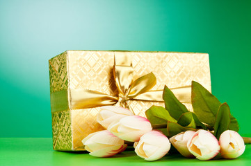 Celebration concept - gift box and tulip flowers