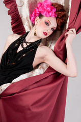 Obraz premium Closeup portrait of fashion woman posing with silck fabric