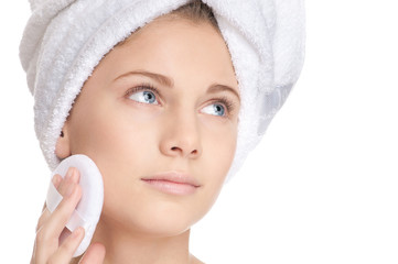 Closeup young beautiful girl with sponge