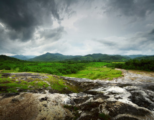 Rocky land and mountains on a horizon