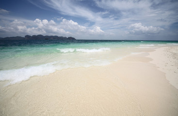 Sea with clear water and sky with clouds